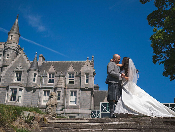 Bride and groom dance outside venue